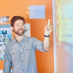 person-planning-on-whiteboard