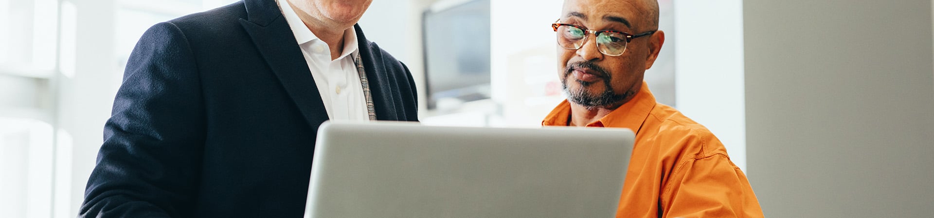 two-people-looking-at-screen