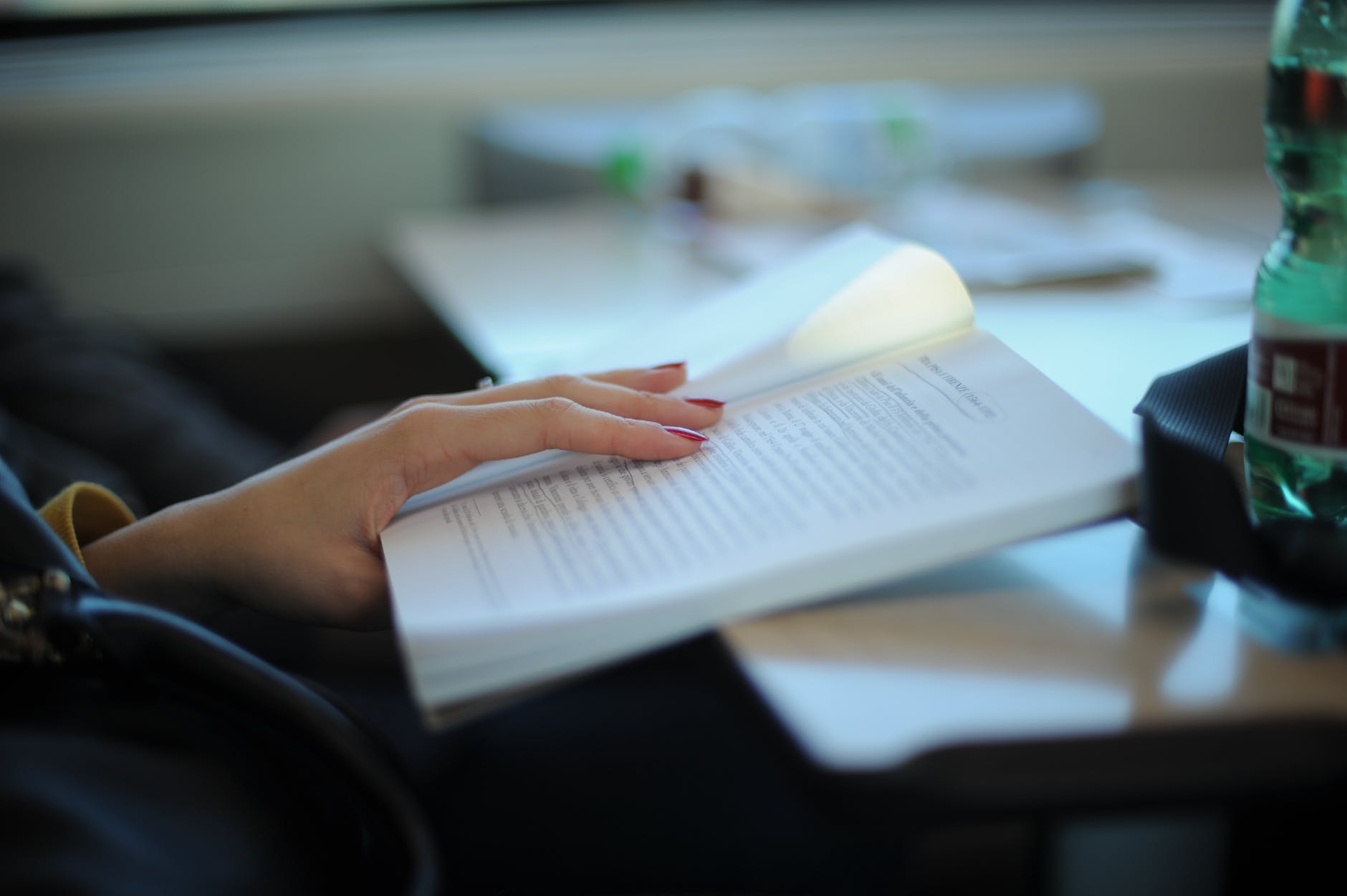 woman-reading-book-guide